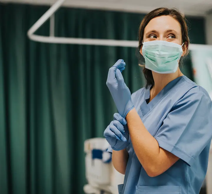 Nurse wearing facemask and gloves