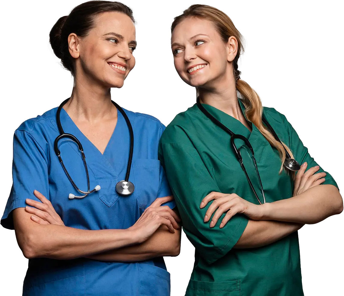 Two nurses smiling at each other
